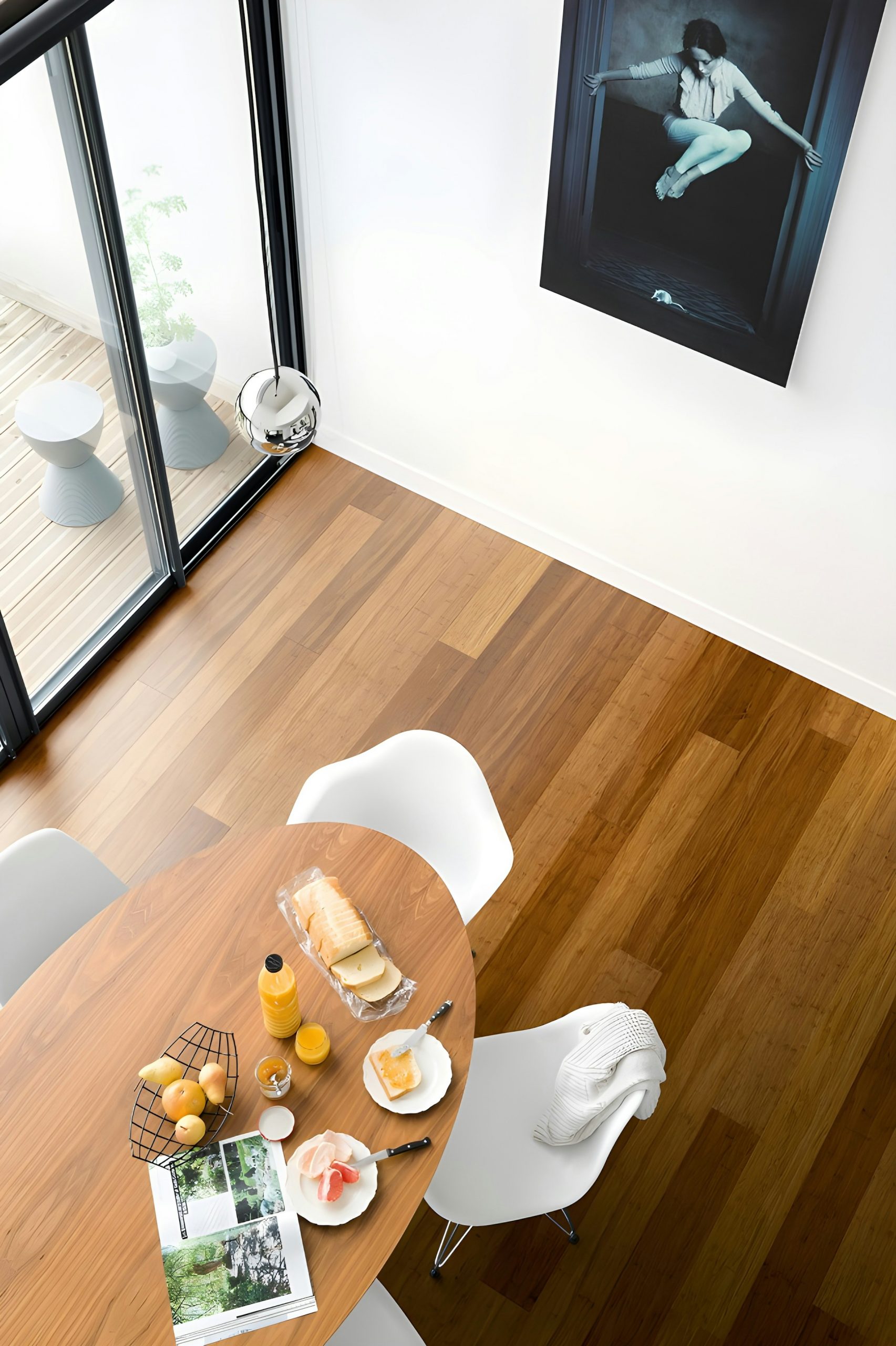 Engineered oak wide-plank flooring in a warm luxury dining room interior