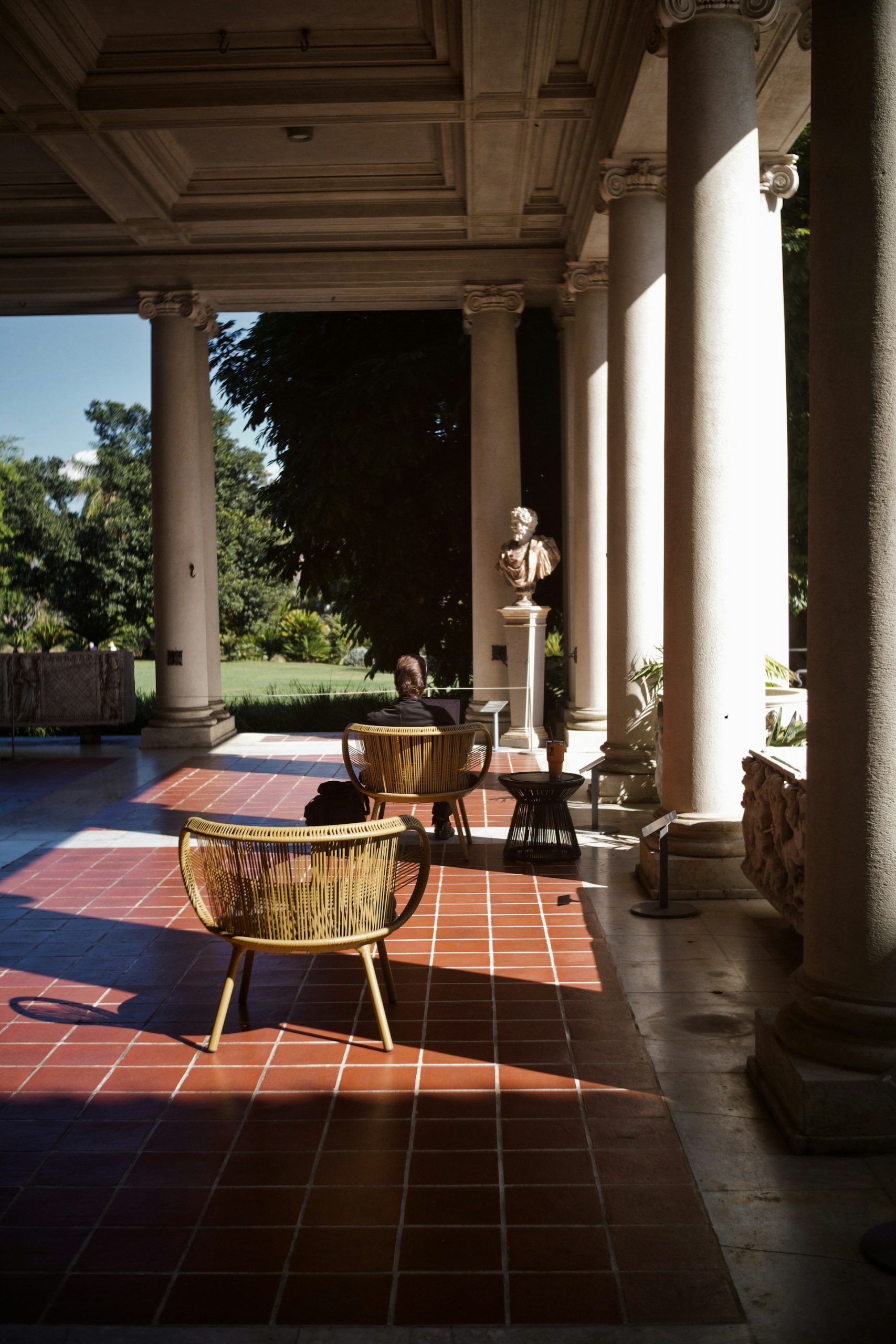 Contemporary outdoor porcelain paving slabs on a luxury terrace with garden views