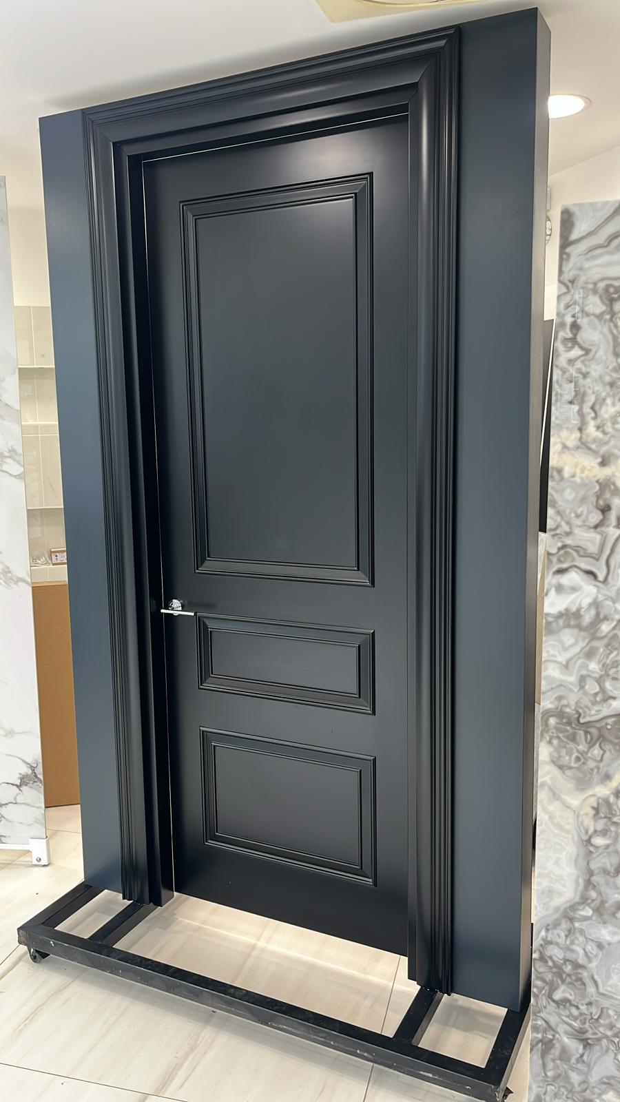 Contemporary flush interior door in a bright minimalist hallway